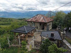 an aerial view of a house with a roof at Vila Muca in Peshkopi