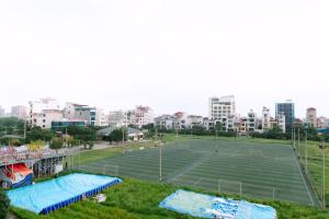 a tennis court in the middle of a city at Nova Hotel - 诺瓦酒店 in Yên Khê
