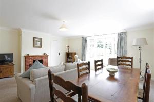 a living room with a couch and a table at 3 Bed in Aldringham oc-pcot in Aldringham