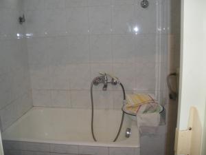 a shower in a bathroom with a bath tub at Siciliana in Caronia