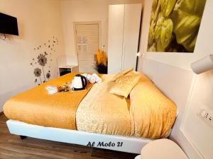 a bedroom with a large bed in a room at Al molo 21 in La Spezia