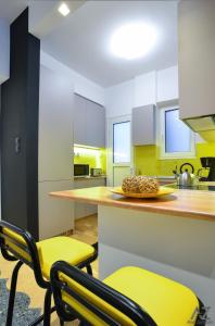 A kitchen or kitchenette at Phaedra Apartment