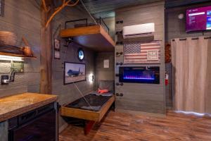 a room with an american flag on the wall at "Air Fort One" Aviation-Themed Luxury Treehouse Near Dollywood & Pigeon Forge in Sevierville