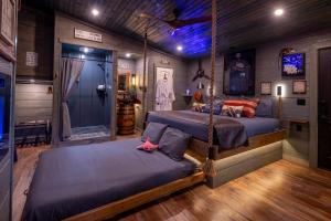 a room with two beds in a train room at "Air Fort One" Aviation-Themed Luxury Treehouse Near Dollywood & Pigeon Forge in Sevierville