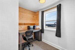 a small office with a desk and a window at Copper Hill Suites in Butte