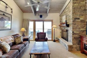 a living room with a couch and a fireplace at Timberline Condominiums 1 Bedroom plus Loft Deluxe Unit D3B in Snowmass Village