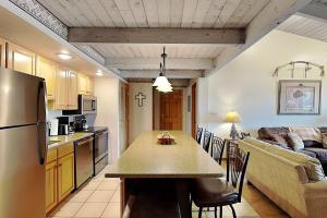 a kitchen and living room with a table and a couch at Timberline Condominiums 1 Bedroom plus Loft Deluxe Unit D3B in Snowmass Village