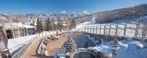 a snow covered ski slope with a ski lodge at Timberline Condominiums 1 Bedroom plus Loft Deluxe Unit D3B in Snowmass Village +20 photos