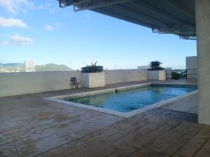a swimming pool on the roof of a building at Kingston Condo with Rooftop Pool & Gazebo in Kingston
