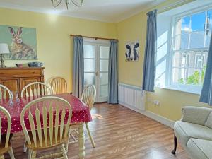a dining room with a table and chairs at Thelma's House - Uk48886 in Belford
