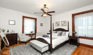 a bedroom with a bed and a ceiling fan at Willough Bed and Breakfast in Conshohocken
