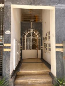 an entrance to a building with a white door at Appartement Berkane in Berkane