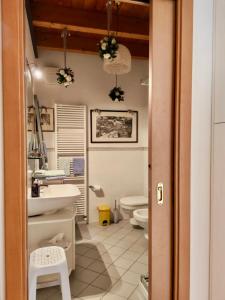 a bathroom with a sink and a toilet at Bed & Breakfast Lucy in Bardolino +32 photos