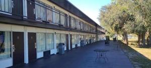 a building with a table in front of it at Paramount Lakeside Inn & Suites in Lakeland