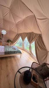 a room with a bed and a table in a tent at Chata Jaga in Szklarska Poręba +62 photos