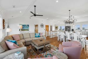 a living room with a couch and a table at Sanctuary in Duck