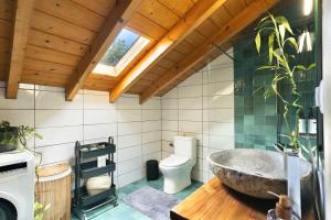 a bathroom with a stone sink and a toilet at The Hidden Attique in Corfu +28 photos