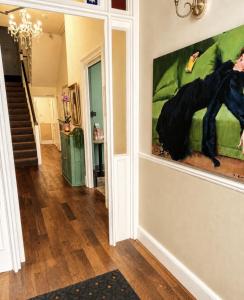 a painting of a horse on a wall in a hallway at The Mariners - Torquay in Torquay