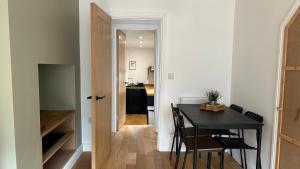 a kitchen and dining room with a table and chairs at Builth wells stay in Builth Wells