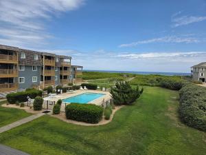 an aerial view of an apartment complex with a swimming pool at Tidewater Star Unit 2i in Duck