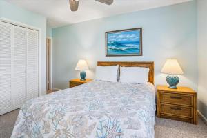 a bedroom with a bed and two night stands at Duck Legacy Unit 2E in Duck +29 photos