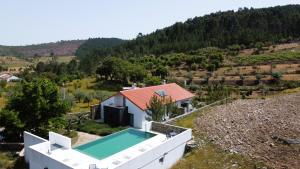 an aerial view of a house with a swimming pool at Casas da Fontanheira in Marvão
