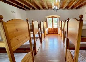 a row of bunk beds in a room at Nuestra Señora de Revenga in Regumiel de la Sierra