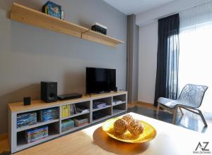 A television and/or entertainment centre at Phaedra Apartment