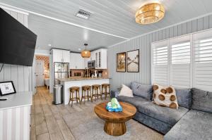 a living room with a couch and a table at Island Vibes House in Clearwater Beach