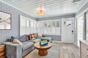 a living room with a couch and a table at Island Vibes House in Clearwater Beach