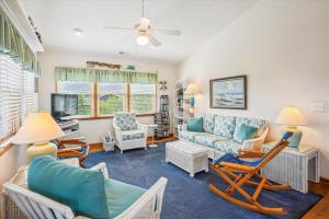 a living room with chairs and a couch at Duck Views in Duck