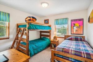 a bedroom with two bunk beds and a bed at Duck Views in Duck +24 photos