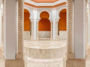 a rendering of a large room with columns at Rixos Murjana - Ultra All Inclusive in King Abdullah Economic City +142 photos