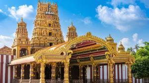 a yellow building with a clock tower on top of it at Island Lanka Tours in Negombo