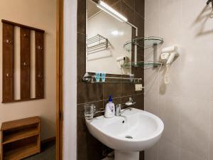 a bathroom with a sink and a mirror at Hotel Old Seti in Mestia +73 photos