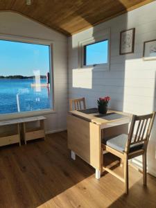 a home office with a desk and a window at Your cottege by the sea in Saltvik