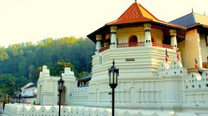 a large white building with a red roof at Island Lanka Tours in Negombo