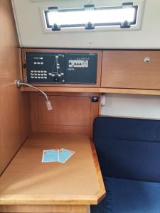 a small table with a book on top of it at Spend a night on a Sailing Boat in Saltvik