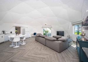 a living room with a couch and a table at Sumner Lake Tiny House in Clermont +19 photos