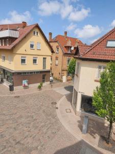 a courtyard in the middle of a group of buildings at Hotel Ochsen in Leonberg +5 photos