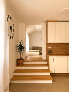 a staircase in a house with a living room at Apartma Arbores in Sveti Jurij ob Ščavnici +17 photos