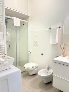 a white bathroom with a toilet and a shower at B&B Sibi in Chieti +66 photos