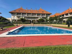 a large swimming pool in front of a large building at La Cometa de Ajo -12016 in Ajo