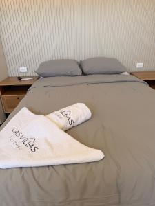 a bed with two towels on top of it at Oceanfront Paradise Family Friendly in Telchac Puerto
