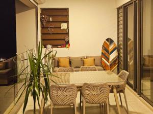 a living room with a table and a couch at Nou Lakaz in Rose Hill +19 photos