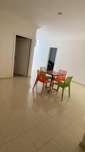 a table and two chairs in a room at Cozy Flat in Tan-Tan in Tan-Tan