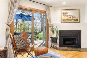 a living room with a fireplace and a patio at Bird's Nest -2BR Downtown Saugatuck Walkable in Saugatuck +19 photos