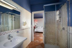 a bathroom with a sink and a shower at Marin Hotel in Pula +64 photos