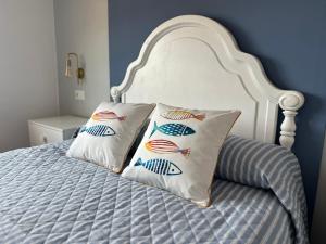 a bed with two pillows on top of it at BOA VISTA in Combarro +52 photos