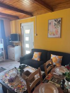 a living room with a couch and a table at Cserke Nyaral-Lak in Cserkeszőlő